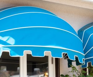 blue awning over window glass of cafe.